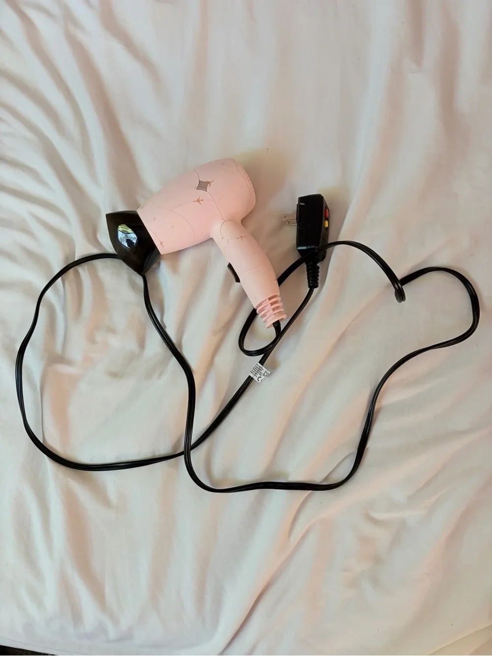 Compact Pink Travel Hair Dryer with Black Nozzle